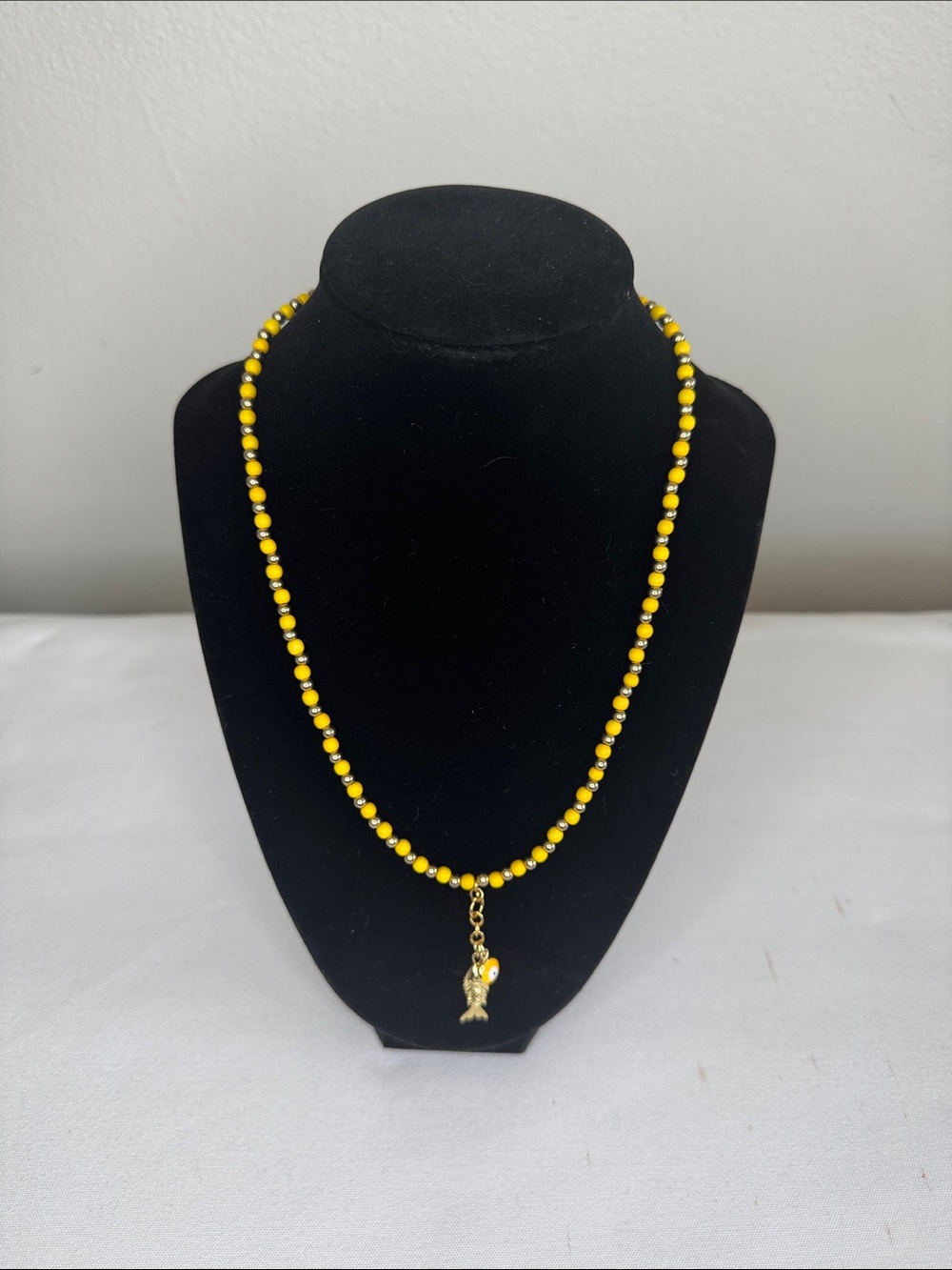 Yellow/Goldtone Beaded Fish & Evil Eye Charms Necklace - Unbranded 18”.